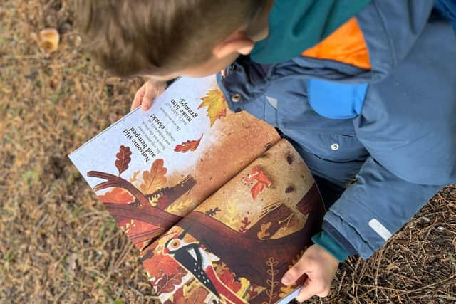 My Son, River, reading the book to find the character we were creating from the book.