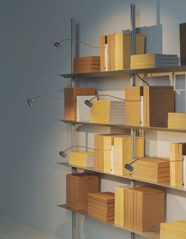 shaped like a book, oscar tusquets' bib luz lamp discreetly integrates into any shelf