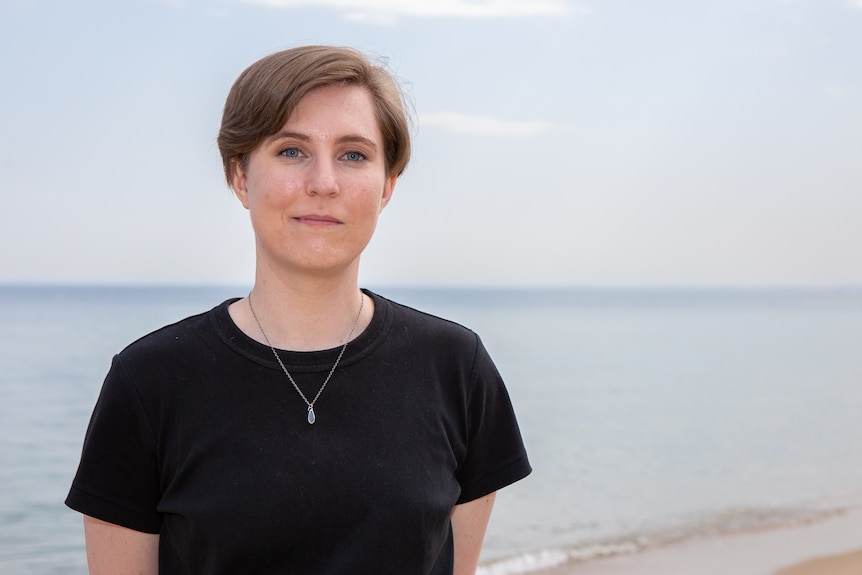 A woman in a black shirt.