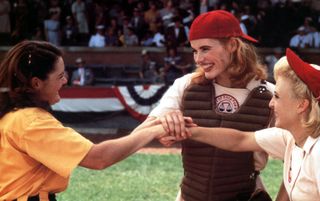 three female baseball players cheer in A league of their own