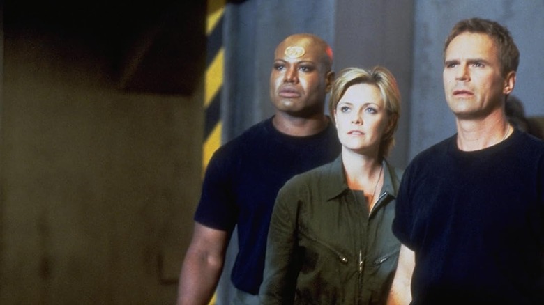 Teal'C, Samantha Carter, and Jack O'Neil in looking on in surprise in Stargate SG-1 season 1