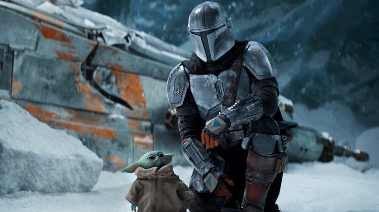 Grogu and Din Djarin on an icy planet in The Mandalorian