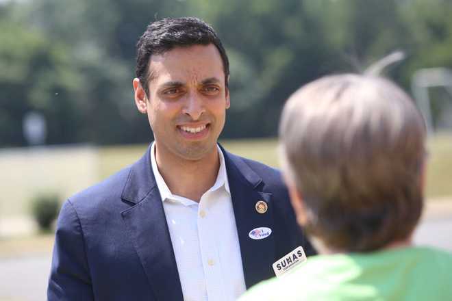 LEESBURG, VA - JUNE 18: State Senator Suhas Subramanyam, running for Virginia&apos;s 10th House seat, talks with voters outside the Harper Park Middle School polling station at  in Leesburg, Virginia on June 18, 2024. Some polling stations are reporting lower turnout today.
(Photo by Mark Miller/The Washington Post via Getty Images)