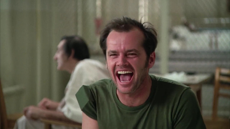 McMurphy laughing in a mental hospital in One Flew Over the Cuckoo's Nest