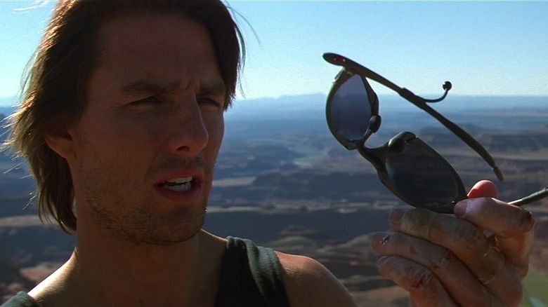 Ethan Hunt on a mountaintop, baffled by a pair of sunglasses.