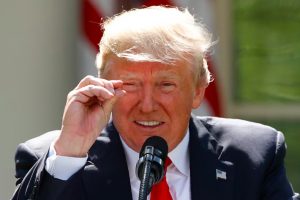 President Donald Trump refers to amounts of temperature change as he announces his decision that the United States will withdraw from the landmark Paris Climate Agreement, in the Rose Garden of the White House in Washington.