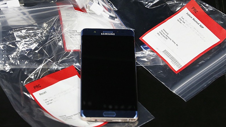 a recalled Samsung Galaxy Note 7 on top of several plastic bags