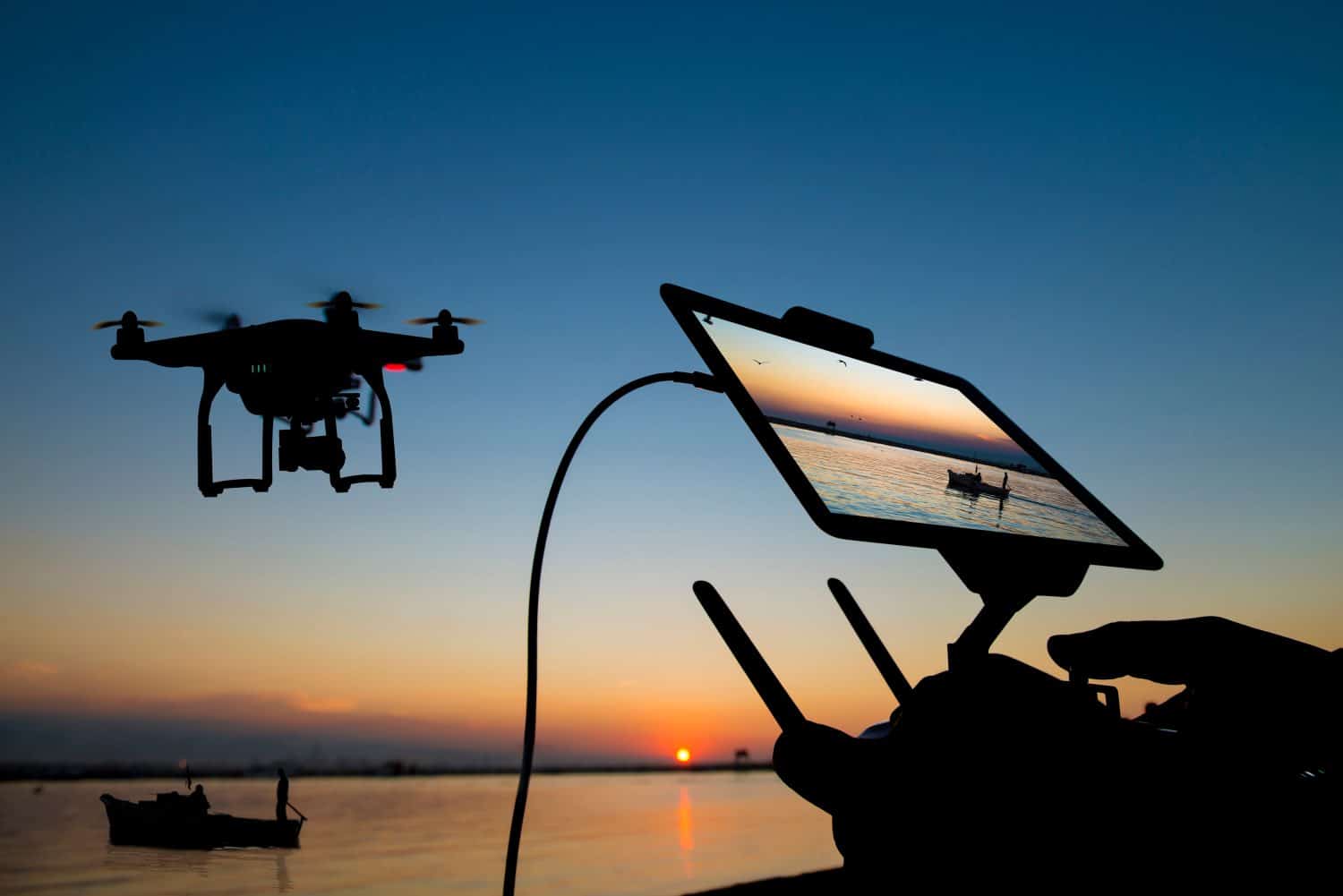 Drone flight remote controller in man hands