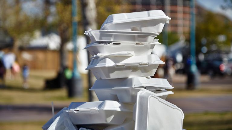 White styrofoam used food containers stacked in trash can in park. Pic: iStock