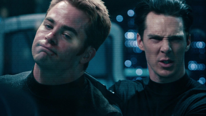 Benedict Cumberbatch as Khan holds Chris Pine as Kirk at gunpoint in Star Trek Into Darkness