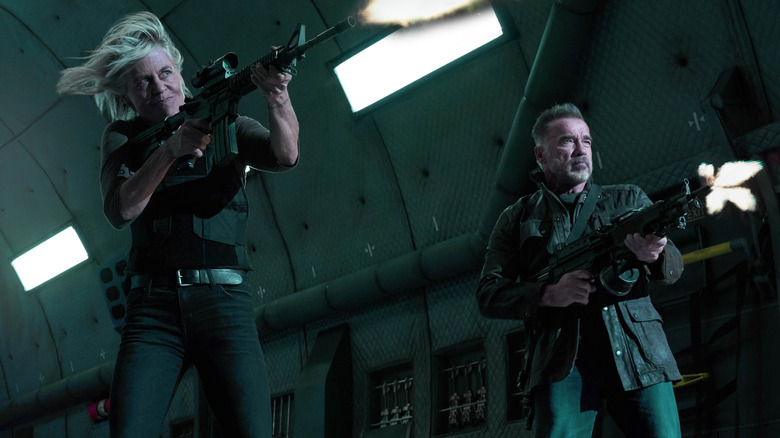 Linda Hamilton and Arnold Schwarzenegger firing guns in Terminator: Dark Fate