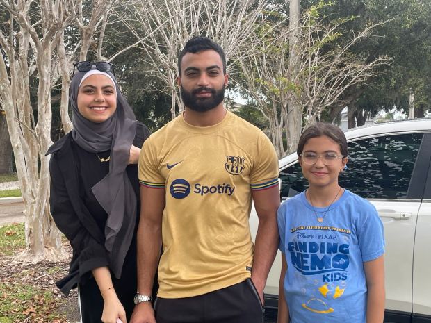 Stockbroker Hamza Almushiti took his two little sisters to vote with him at Precinct 541 in East Lake Elementary School on Tuesday, Nov. 5, 2024, as he chose advocating for Palestinians over his registered party. (Gabriella Jaye Herrera/Special to the Orlando Sentinel)