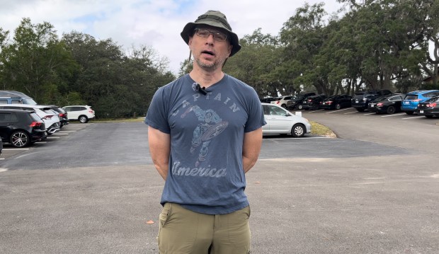 Orange County structural engineer Christopher Banbury talks about Donald Trump at the St. Matthew's Episcopal Church voting precinct on Tuesday, Nov. 5, 2024. (Maci Castillo/Special to the Orlando Sentinel)