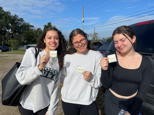 First-time voters Tatiana Ortiz, 19, Isabella Ortega, 20, and Ashlyn Watson, 19, from left, head home after casting their votes at Iglesia Pentecostal Unida Latin Americana in Orange County. (Sofia Sutter/Special to the Orlando Sentinel)