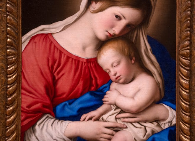 This Madonna and Child oil painting, from the 1600s, from the Workshop of Sassoferrato (Giovanni Batissta Salvi), is seen on display Tuesday, Dec. 10, 2024 at the Indianapolis Museum of Art at Newfields. This painting was conserved and has been chosen as one of the images included in this year’s winter holidays’ collection of postage stamps at the United Postal Service.