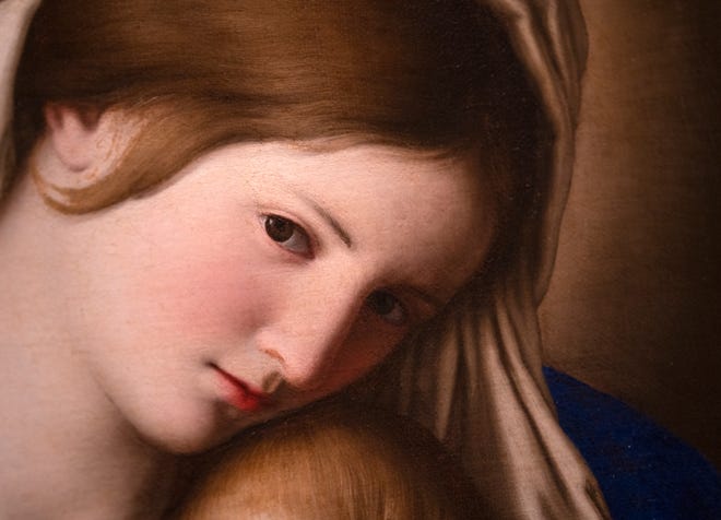 This is a detail of the Madonna and Child oil painting, from the 1600s, from the Workshop of Sassoferrato (Giovanni Batissta Salvi), seen on display after it was conserved, Tuesday, Dec. 10, 2024 at the Indianapolis Museum of Art at Newfields. This painting was conserved and has been chosen as one of the images included in this year’s winter holidays’ collection of postage stamps at the United Postal Service.