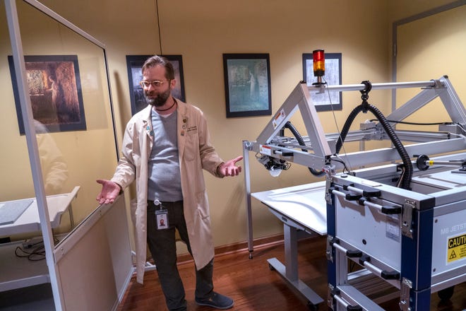 Senior Conservation Scientist Greg Smith shows an X-ray florescence analysis machine in his analytical lab Tuesday, Dec. 10, 2024 at the Indianapolis Museum of Art at Newfields. It will pass over the surface of a piece of artwork scanning and collecting a full spectrum of information on the elements found in locations all over the work. This can help with time dating and authentication of artwork.