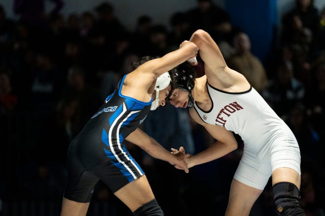 Dec 20, 2024; Wayne, NJ, USA; Clifton wrestling at Passaic Tech. (Left) Passaic Tech’s Rayan Mohammad and Clifton’s Jarrett Rodriguez in their 126 pound match.