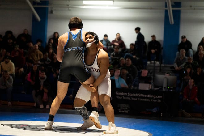 Dec 20, 2024; Wayne, NJ, USA; Clifton wrestling at Passaic Tech. (Right) Clifton’s Justin Gaviria and Passaic Tech’s James Kestenholz in their 215 pound match.