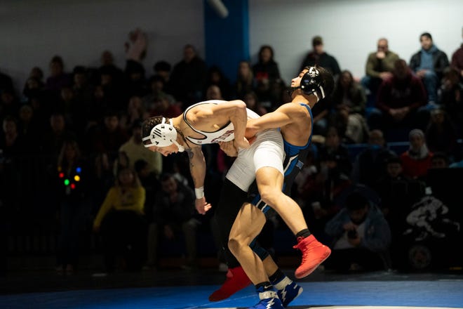 Dec 20, 2024; Wayne, NJ, USA; Clifton wrestling at Passaic Tech. (Right) Passaic Tech’s Malik Abuharthieh and Clifton’s Jason Cancel in their 132 pound match.