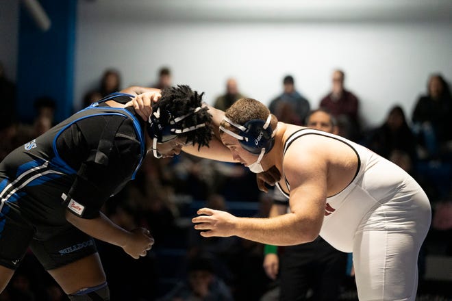 Dec 20, 2024; Wayne, NJ, USA; Clifton wrestling at Passaic Tech. (Left) Passaic Tech’s Jason Dixon and Clifton’s Isaac Cazimovski in their 285 pound match.