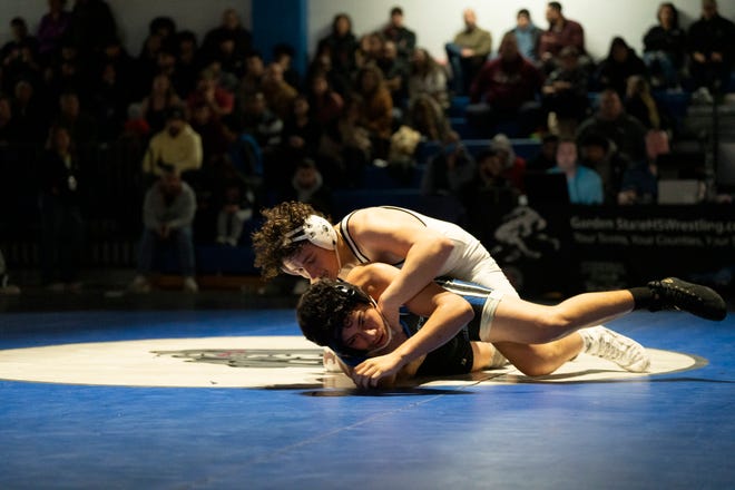 Dec 20, 2024; Wayne, NJ, USA; Clifton wrestling at Passaic Tech. (Right) Clifton’s Nick Doctor and Passaic Tech’s Erick Montiel in their 190 pound match.