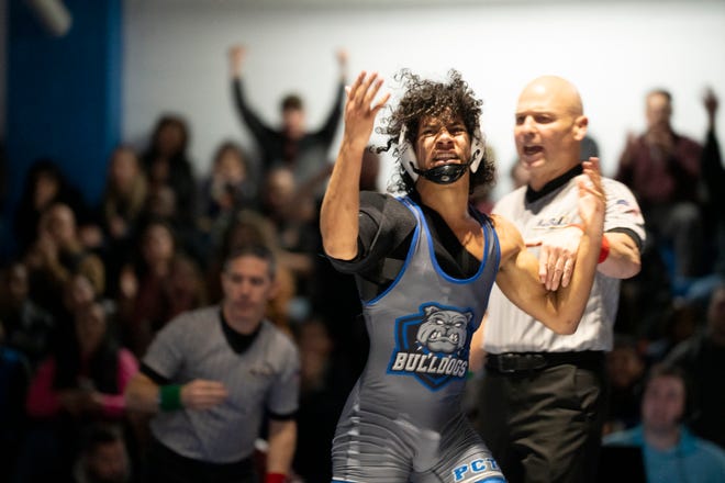 Dec 20, 2024; Wayne, NJ, USA; Clifton wrestling at Passaic Tech. Passaic Tech’s Ismael Vertedor celebrates winning his 138 pound match.