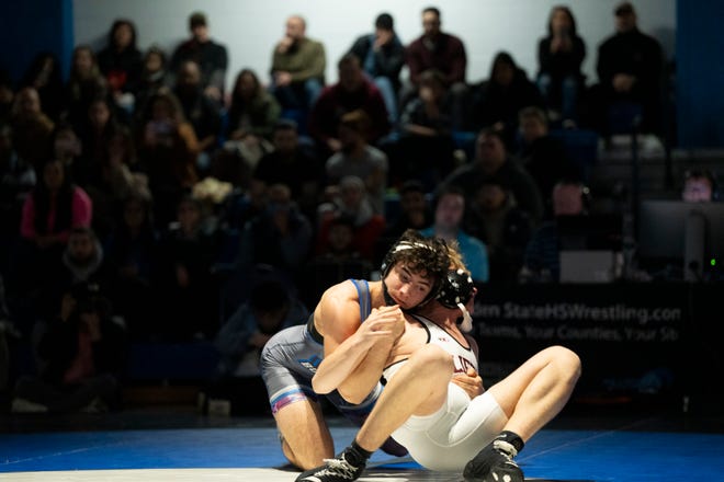 Dec 20, 2024; Wayne, NJ, USA; Clifton wrestling at Passaic Tech. (Left) Passaic Tech’s James Conklin and Clifton’s Jacob Organisciak in their 157 pound match.