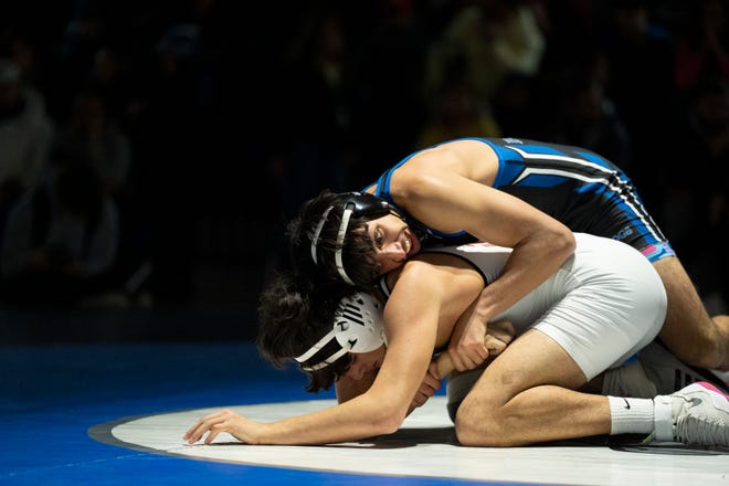 Dec 20, 2024; Wayne, NJ, USA; Clifton wrestling at Passaic Tech. (Right) Passaic Tech’s Naseem Abdelaziz and Clifton’s Jordyn Rivera in their 144 pound match.