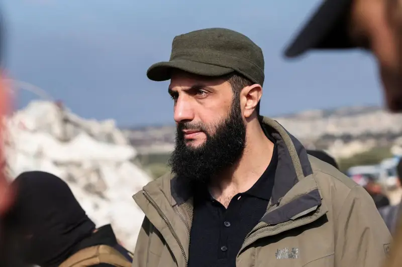 Hayat Tahrir al-Sham chief Abu Mohammad al-Jolani checks the damage following an earthquake in the village of Besnaya in Syria’s northwestern Idlib province on Feb. 7, 2023.