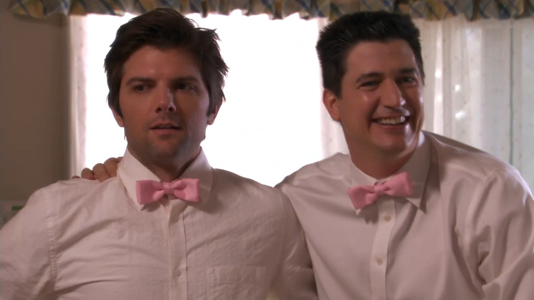 Adam Scott and Ken Marino as Henry Pollard and Ron Donald shoulder hugging awkwardly at a catering event on Party Down