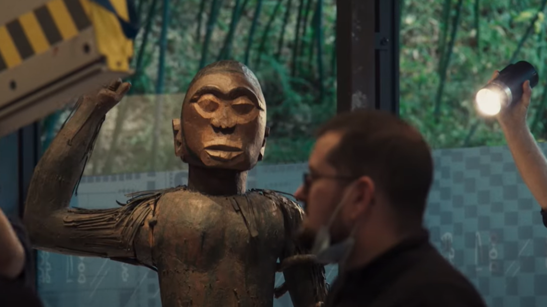 A wooden statue of King Ghezo, who led Dahomey in the 19th century, is given a voice of its own in Dahomey.