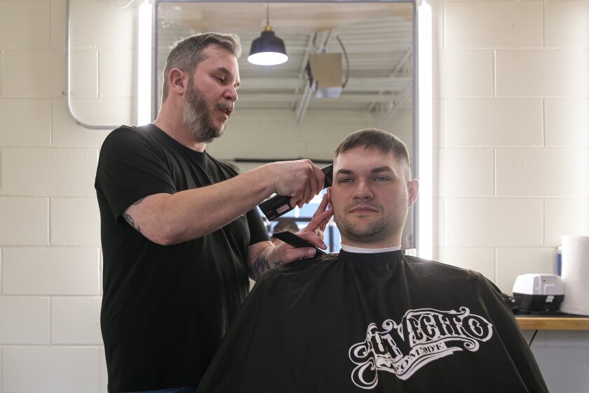 Scott Ehresman cuts Troy Steele's hair on Monday, Jan. 6, 2025, at Nice Barber Company in north Fargo. 