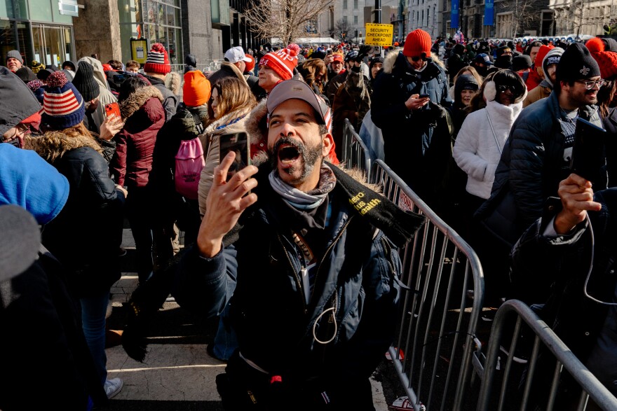 A 52-year-old New York City man who goes by “Claroscuro” yells “We finally have a president!” After President Donald Trump is sworn in for his second term in office while waiting in line to enter a victory rally at Capital One Arena on Monday, Jan. 20, 2025, in Washington D.C.