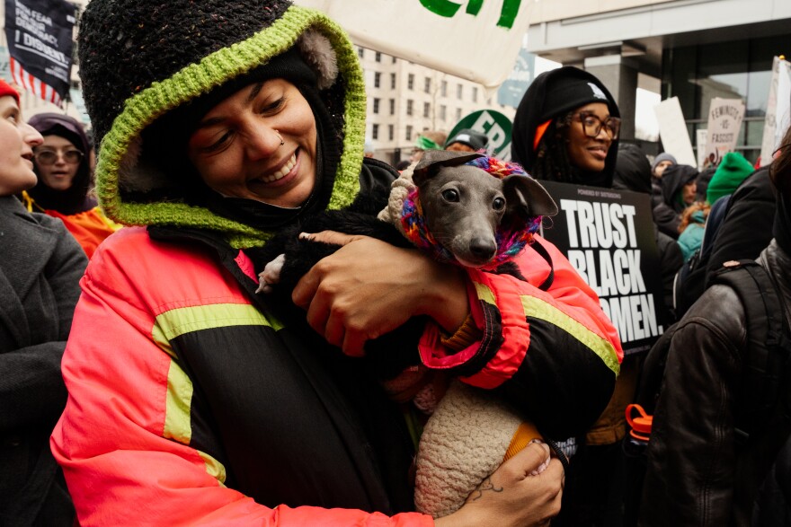 Dallas Diaz, a 29-year-old protestor from Brooklyn, N.Y., holds “Dennis Rodman,” her 4-month-old Italian Greyhound, while marching alongside thousands to protest Donald Trump’s inauguration as the 47th president of the United States on Saturday, Jan. 18, 2025, in Washington D.C.