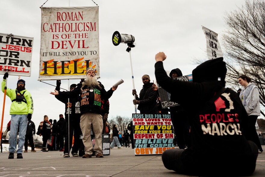 Demonstrators confront members counterprotesting the People’s March on Saturday, Jan. 18, 2025, outside the Lincoln Memorial in Washington D.C.