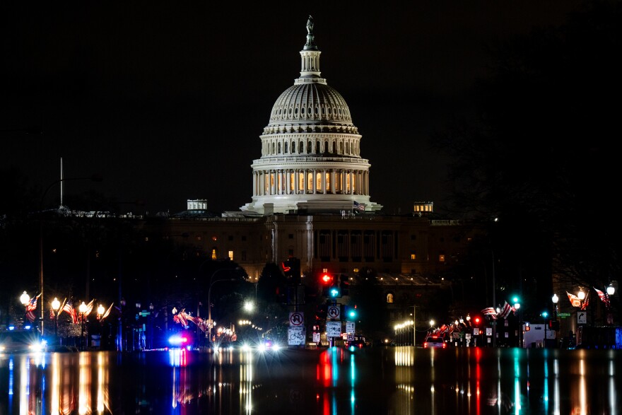 Cars drive in front of the United State Capitol on Sunday, Jan. 19, 2025, the night before Donald Trump’s inauguration as the 47th president of the United States in Washington D.C.