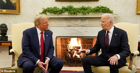 FILE PHOTO: U.S. President Joe Biden meets with President-elect Donald Trump in the Oval Office at the White House in Washington, U.S., November 13, 2024. REUTERS/Kevin Lamarque/File Photo