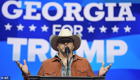 FILE - Country music singer Jason Aldean speaks before Republican presidential nominee former President Donald Trump at a Turning Point Action campaign rally, Oct. 23, 2024, in Duluth, Ga. (AP Photo/Alex Brandon, File)