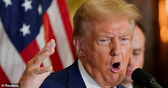 FILE PHOTO: Republican presidential nominee and former U.S. President Donald Trump gestures as he speaks during a press conference at Trump Tower in New York City, U.S., September 6, 2024. REUTERS/David Dee Delgado/File Photo