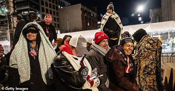 WASHINGTON, DC - JANUARY 20: People wait on line to get into Capital One Arena for Donald Trump's inauguration celebration on January 20, 2025 in Washington, DC. U.S. President-elect Donald Trump and Vice President-elect JD Vance will be sworn in on January 20 in an indoor ceremony in the rotunda of the U.S. Capitol with a celebration at the Arena after. (Photo by Stephanie Keith/Getty Images)