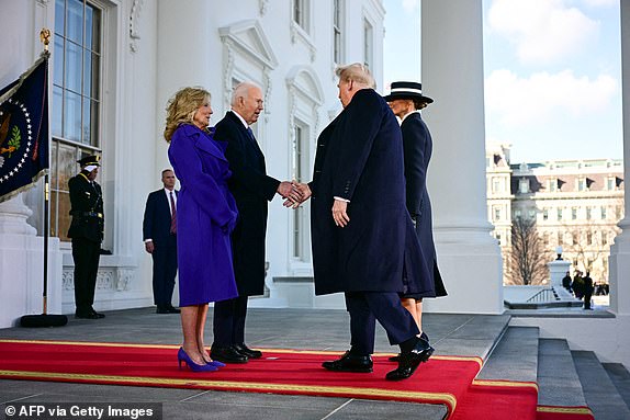 US President Joe Biden and First Lady Jill Biden greet President-elect Donald Trump and Melania Trump as they arrive at the White House in Washington, DC, on January 20, 2025, before departing for the US Capitol where Trump will be sworn in as the 47th US President. (Photo by Jim WATSON / AFP) (Photo by JIM WATSON/AFP via Getty Images)