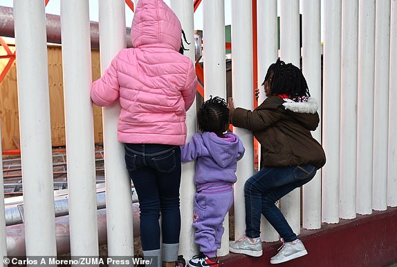 Mandatory Credit: Photo by Carlos A Moreno/ZUMA Press Wire/Shutterstock (15110699a) Migrant children from Haiti play as they wait for their CBP One appointments at the El Chaparral border port in Tijuana, Mexico. US President Donald Trump during his inauguration said that he will issue a raft of executive orders aimed at reshaping citizenship and immigration starting with the asylum process among others. The Trump administration shut down the CBP One app for migrants. The Biden-era process allowed nearly 1 million migrants to enter the US at legal border crossings since the app initiated. Trump Shut Downs CBP One Asylum App, Tijuana, Baja California, Mexico - 20 Jan 2025