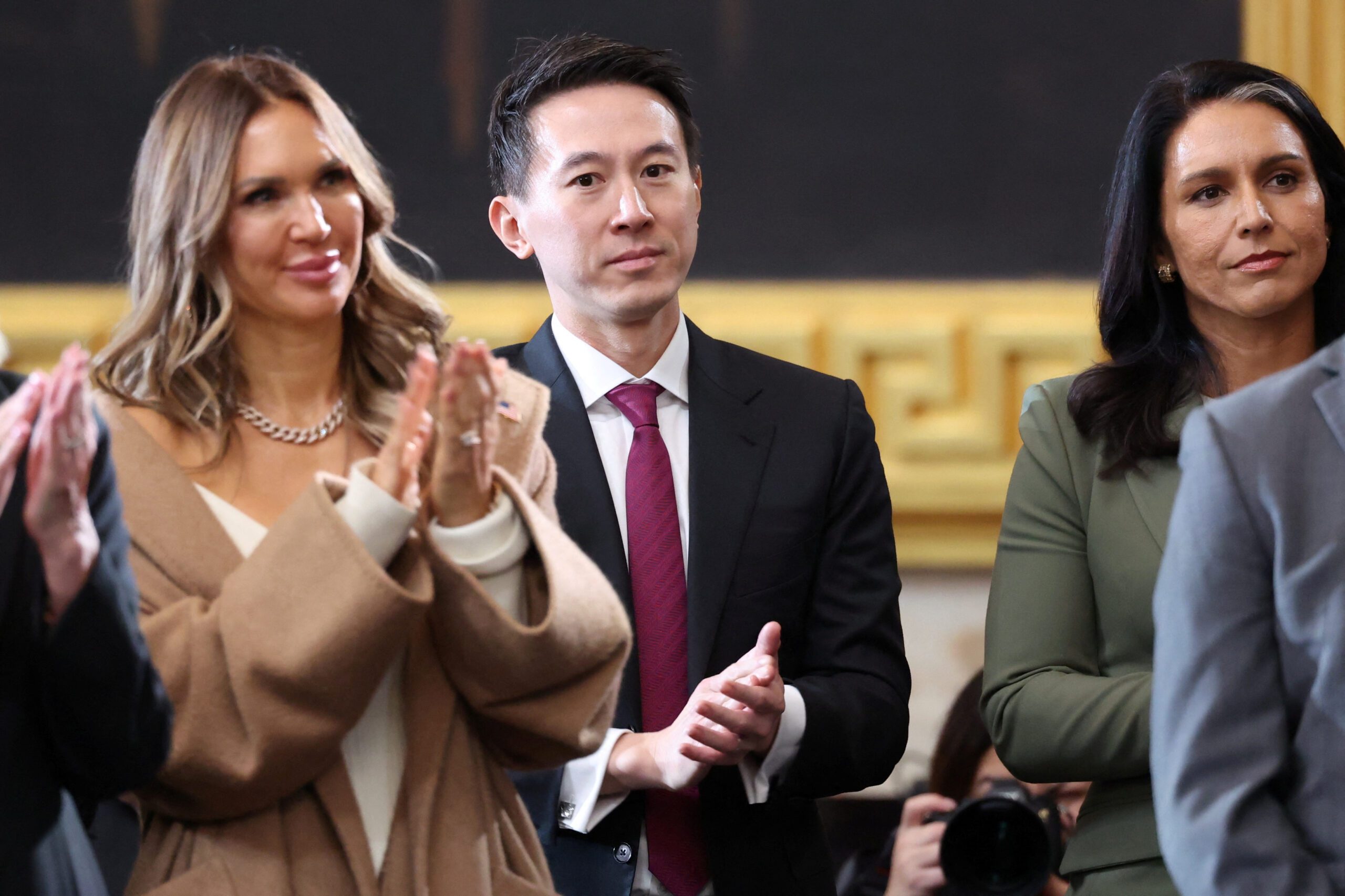 Shou Zi Chew and Tulsi Gabbard applaud at Donald Trump's presidential inauguration.