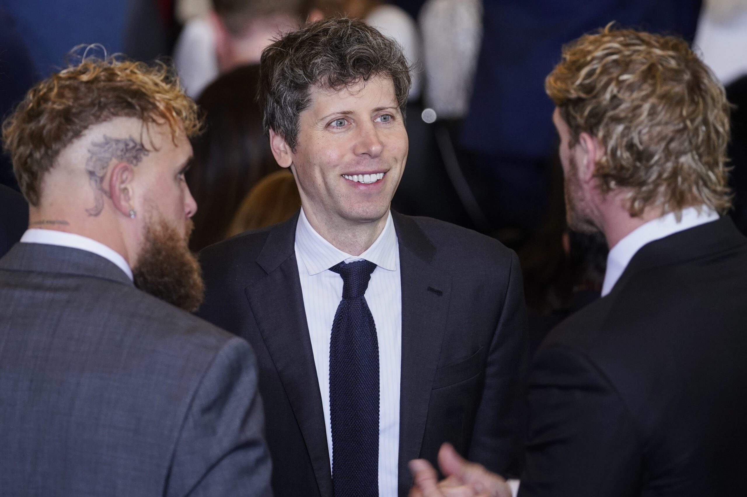 Sam Altman speaking with Jake Paul and Logan Paul.