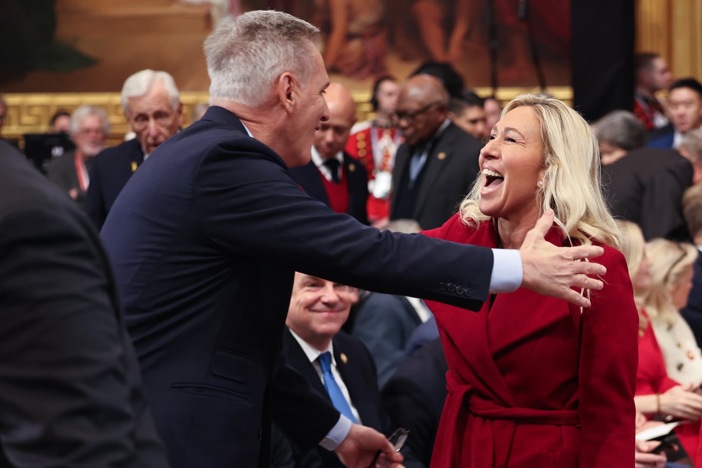 Former speaker of the House Kevin McCarthy greets US Representative Marjorie Taylor Greene as they arrive to the inauguration of US President-elect Donald Trump in the Rotunda of the Capitol on Jan. 20, 2025 in Washington, D.C. 