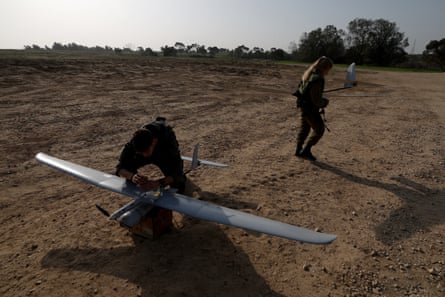 Israeli soldiers prepare to release military drones at an undisclosed location near the southern part of the Israeli border with the Gaza Strip, on 9 January 2024.