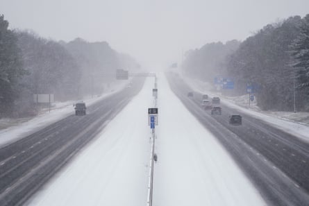 View of snowy highway from an overpass