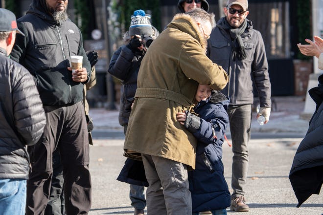 Bruce Springsteen hugs Matthew Anthony Pellicano, 9, who is playing the role as a young Bruce Springsteen, during the filming of the Bruce Springsteen movie Deliver Me from Nowhere in Freehold, NJ Friday, January 10, 2025. Both Jeremy Allen White and Bruce Springsteen were on set.