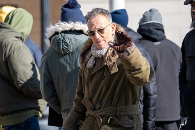 Bruce Springsteen waves to a crowd of fans during the filming of the Bruce Springsteen movie Deliver Me from Nowhere in Freehold, NJ Friday, January 10, 2025. Both Jeremy Allen White and Bruce Springsteen were on set.